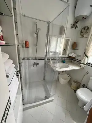 a bathroom with a shower and a sink at Casa Della Laguna in Gouna in Hurghada