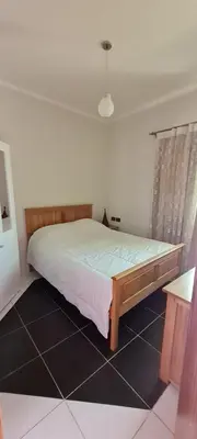a bedroom with a large bed in a room at Hurghada Cosy Apart in Hurghada