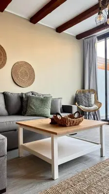 a living room with a couch and a coffee table at 1BR villa - private heated pool in Bali ElGouna in Hurghada
