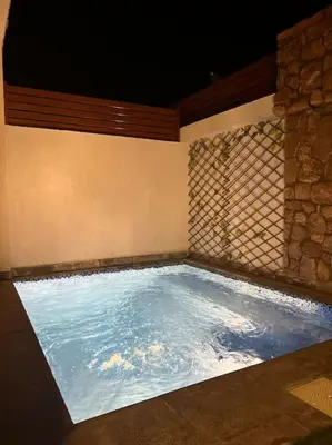 a large pool of water in a room at 1BR villa - private heated pool in Bali ElGouna in Hurghada