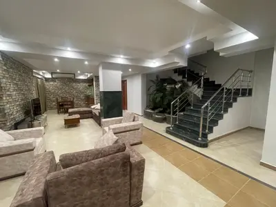 a large living room with couches and a staircase at Hurghada-Magawish Villa 4 in Hurghada