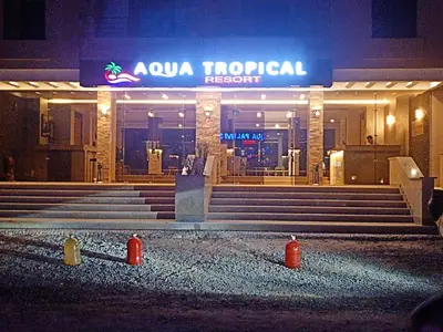 a building with stairs and a sign that reads kuna moral resort at Ubytovani v novém resortu Aqua Tropical poblíž El Gouny in Hurghada