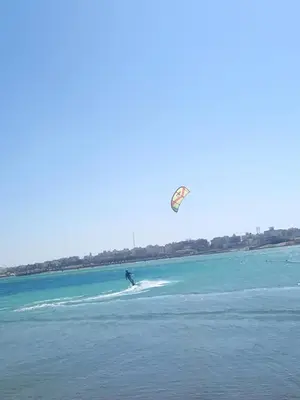 a person is kite surfing in the water at Ubytovani v novém resortu Aqua Tropical poblíž El Gouny in Hurghada