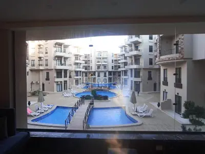 a view of a swimming pool from a window of a building at Ubytovani v novém resortu Aqua Tropical poblíž El Gouny in Hurghada