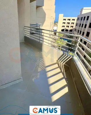 a shadow of a person on a balcony of a building at CAMUS 343, Princess Resort in Hurghada