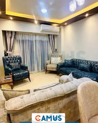 a living room with a couch and two chairs at CAMUS 343, Princess Resort in Hurghada