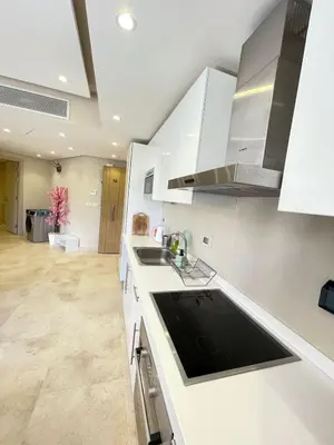 a kitchen with white cabinets and a sink at El Gouna Mangroovy 1-Bedroom Sleeps 4-Persons, M8-4C-14 in El Gouna