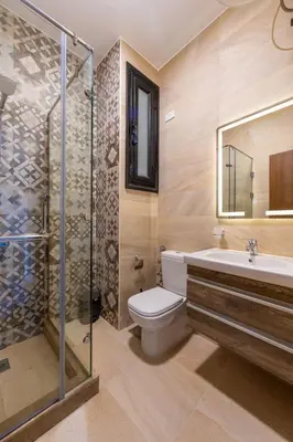 a bathroom with a toilet and a sink and a shower at Felfela View in Hurghada