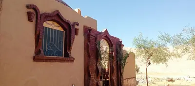a building with two windows on the side of it at Mountain View House in ‘Ezbet Abu Ḥabashi