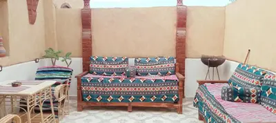 a living room with a couch and a table at Mountain View House in ‘Ezbet Abu Ḥabashi