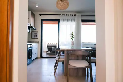 a kitchen and dining room with a table and chairs at Makadi Heights Elite Worldwide Residences - Hurghada, Egypt in Hurghada