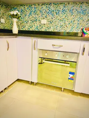 a kitchen with a counter with a oven in it at Luna Blu Sea View in Hurghada
