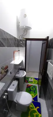a bathroom with a toilet and a sink at Magic Place Luxor in Luxor