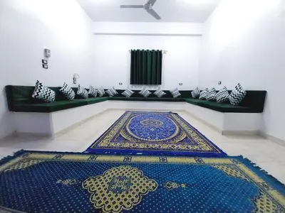 a room with a blue and gold rug on the floor at Magic Place Luxor in Luxor