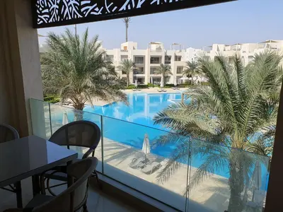 a view of a swimming pool from a hotel balcony at Mangroovy 2BR with roof in Hurghada