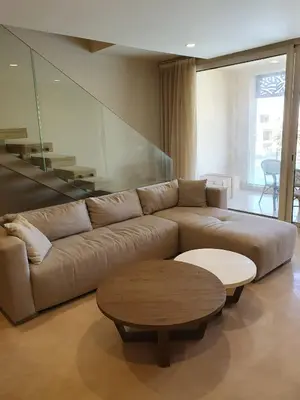 a living room with a couch and a coffee table at Mangroovy 2BR with roof in Hurghada