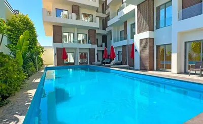 a swimming pool in front of a building at Imperial Resort Apt Sleeps 3 - Pool Parking Wifi in Hurghada