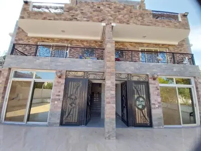 a house with wrought iron gates and windows at Emad villa in Hurghada
