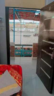a room with a bed and a view of a stadium at Onaty Narty Guest house Nile view in Aswan