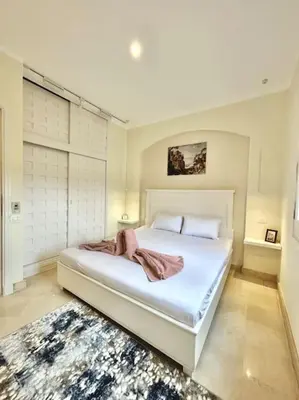a bedroom with a large white bed in a room at SunShine Y1-1-19 in Hurghada