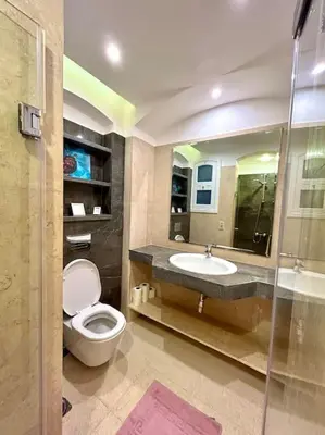 a bathroom with a toilet and a sink at SunShine Y1-1-19 in Hurghada