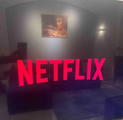 a red neon sign that says netflix on a wall at SunShine Y1-1-19 in Hurghada