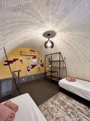 a room with two bunk beds and a wall with a ceiling at SunShine Y1-1-19 in Hurghada