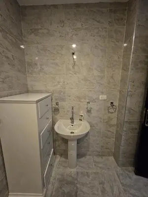 a bathroom with a sink and a shower at Noura Luxury Hotel Villa with free Pool and Beach access in Hurghada in Hurghada