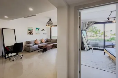 a living room with a couch and a table at Cordial & Cozy 1 BDR G Cribs in Hurghada