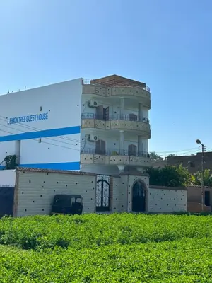 a control tower on top of a building at Lemon Tree apartments luxor in Al Aqālitah