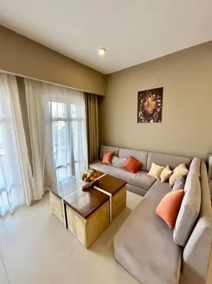 a living room with a couch and a coffee table at SunShine AbuTig Marina in Hurghada
