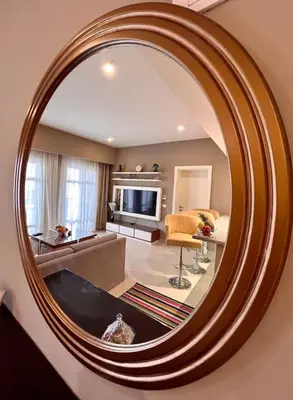 a mirror in a room with a living room at SunShine AbuTig Marina in Hurghada