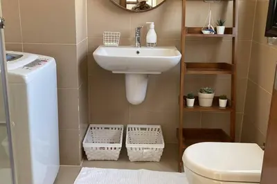 a small bathroom with a sink and a toilet at Baywest Villa, Somabay in Safaga