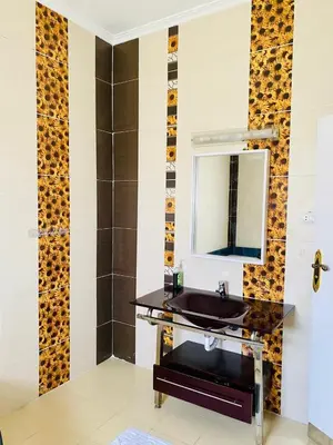 a bathroom with a sink and a mirror at Villa 6 in Hurghada