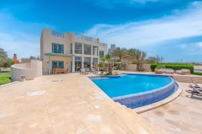 a villa with a swimming pool and a patio at Golf Luxury villa with private pool in Hurghada