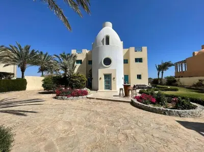a large white building with a dome at Golf Luxury villa with private pool in Hurghada