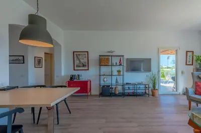 a living room with a table and a couch at unique flat_ garden and lagoon in Hurghada