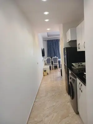 a room with a kitchen and a living room at Selena Bay Resort & beach in Hurghada