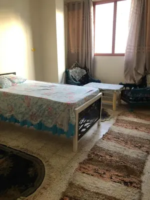 a bedroom with a bed and a window at NUB Guest House in Aswan