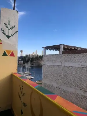 a view from the balcony of a building overlooking a river at NUB Guest House in Aswan