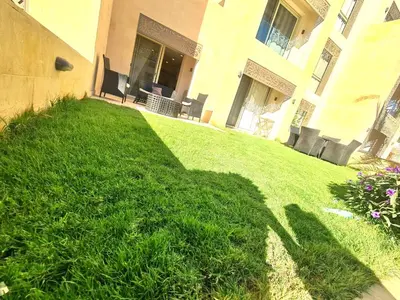 a shadow of a person on a lawn at Fabulous Sea view 1 BR & private Garden to the pool at Mangroovy in Hurghada