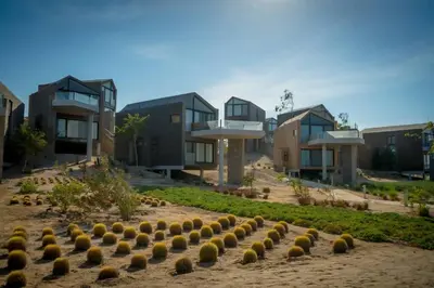 a row of houses with plants in front of them at Modern Soma Bay 2BR Villa w sea views, beach & pool access in Hurghada