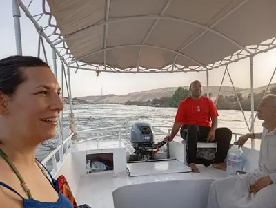 a group of people on a boat on the water at Kashta Nubian Guest Houst in Aswan