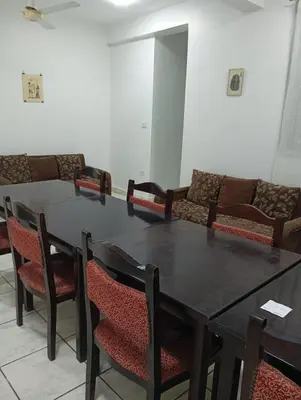 a dining room with a table and chairs at Abeer Guest House in Luxor