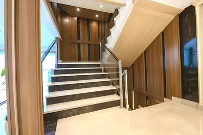 a staircase in a house with wooden walls and ceilings at Five Star Deluxe River Kruz from Aswan to Luxor 3 Nights in Aswan