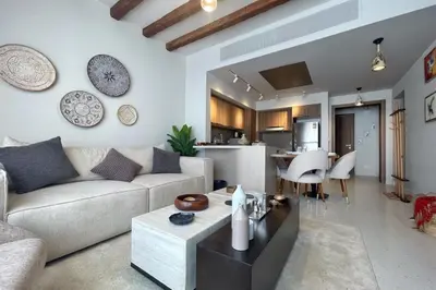 a living room with a couch and a table at Captivating 1 BDR Fanadir Marina in Hurghada