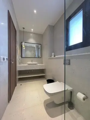 a bathroom with a toilet and a sink at Captivating 1 BDR Fanadir Marina in Hurghada
