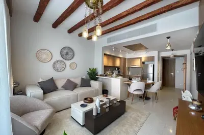 a living room with a couch and a table at Captivating 1 BDR Fanadir Marina in Hurghada