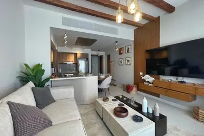 a living room with a couch and a large television at Captivating 1 BDR Fanadir Marina in Hurghada
