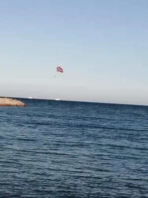 a kite flying over the water in the ocean at Cecelia Resort Hurghada in Hurghada